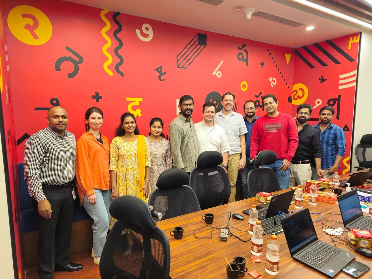 Team photo — Hyderabad office colourful wall